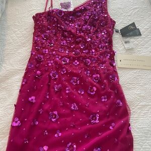 Beautiful Orchid one shoulder gown.